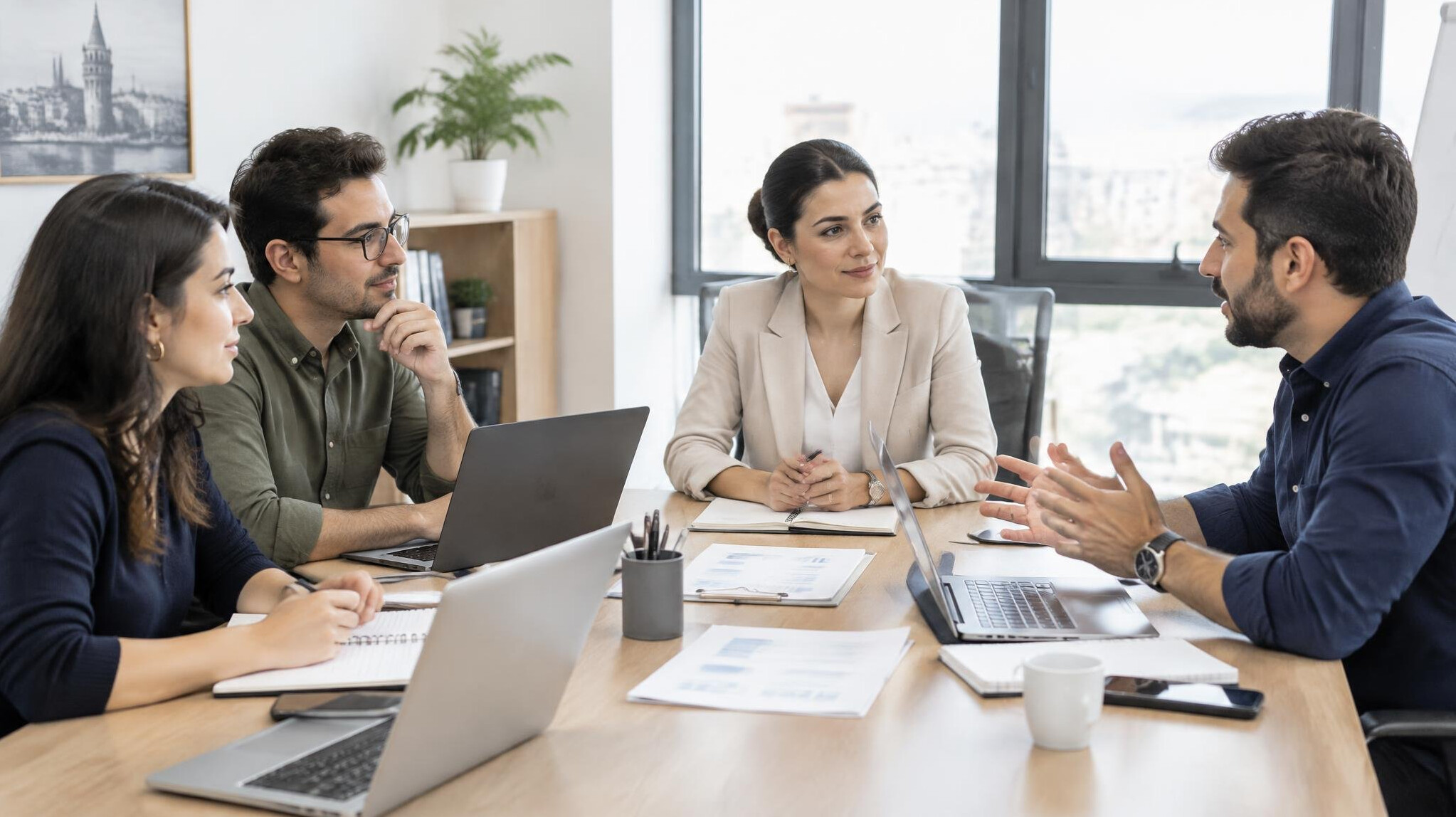 Team discussing around a table in a meeting